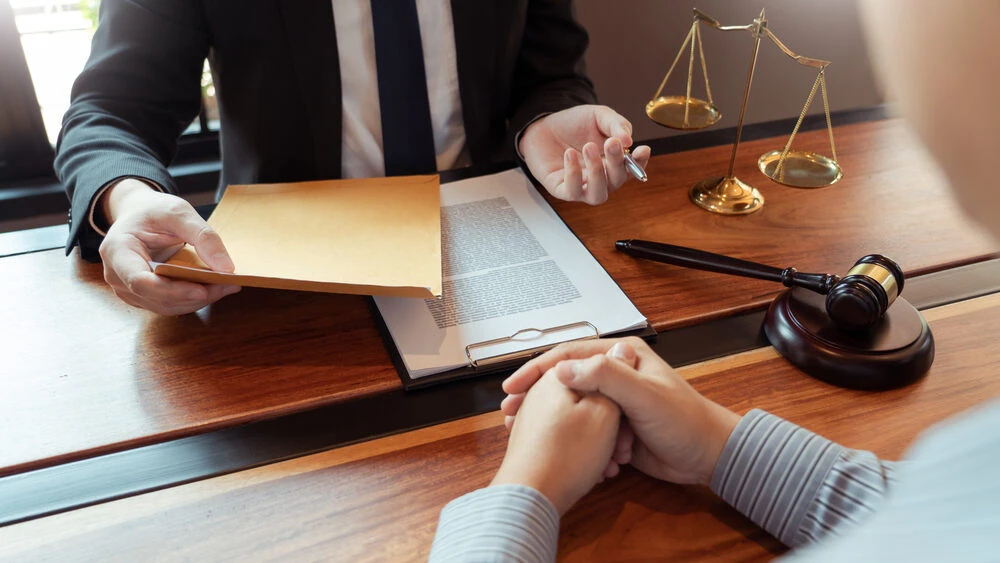 Male Notary lawyer or judge consult or discussing contract papers with Businessman