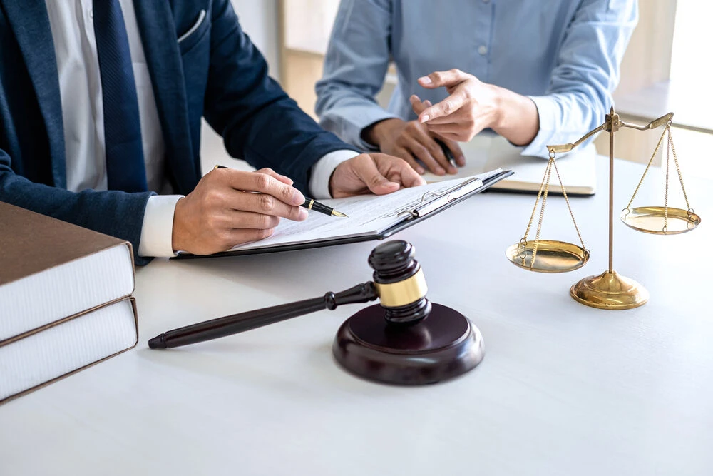 Businesswoman and Male lawyer or judge consult and conference having team meeting with client at law firm in office