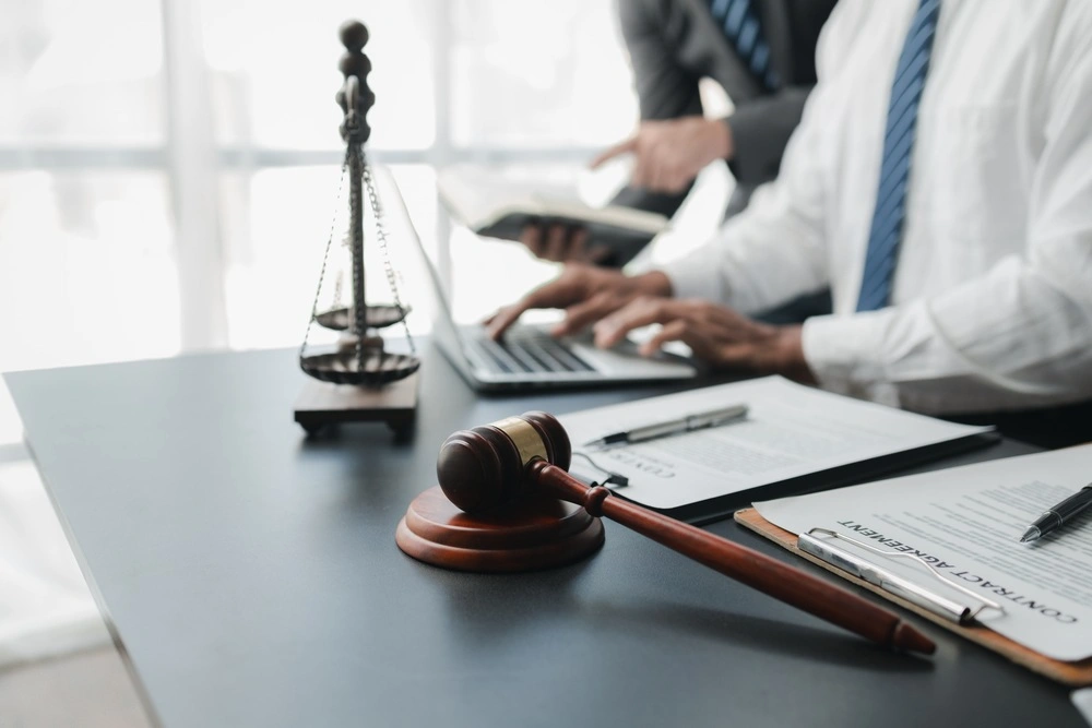 Two lawyers are meeting together to brainstorm ideas